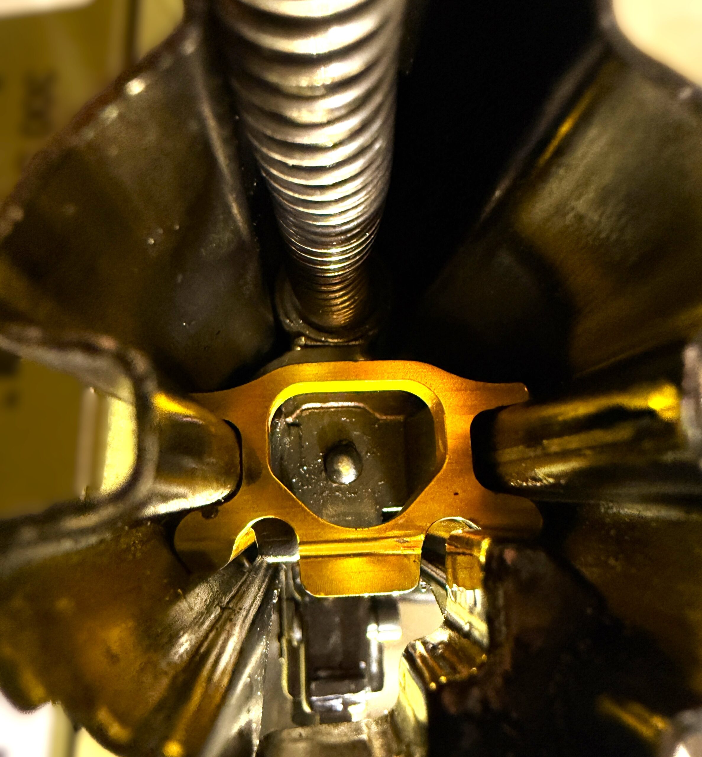 Gold anodized Gunetic Innovations V4 Slip Trip installed inside MP5 Leber V2 trigger housing slip trip, trip slip, v4 trip metal trip, aluminum trip for mp5, mac5, ap5 mac5k sp5, sp5k,ap5p