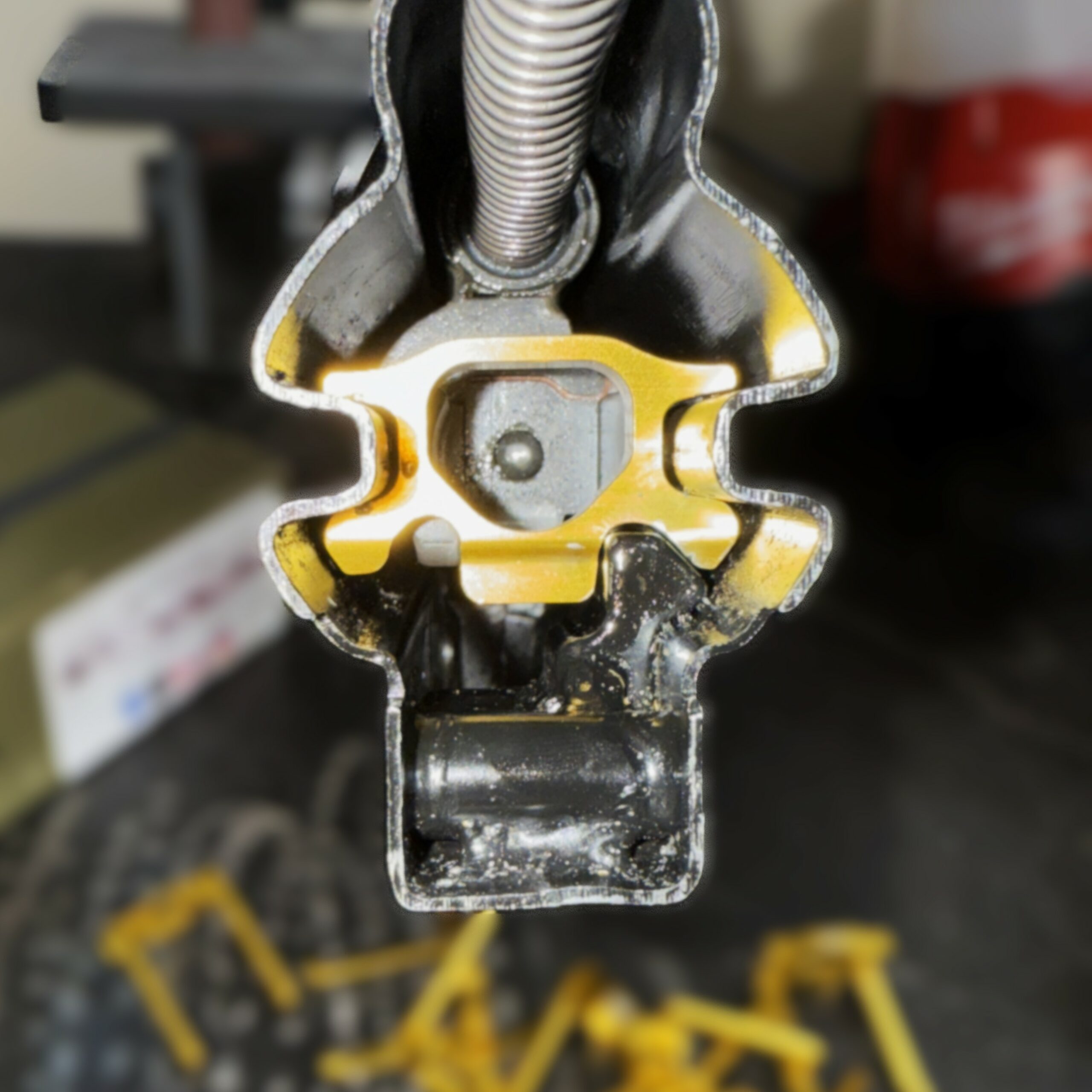 Collection of gold anodized Gunetic Innovations V4 Slip Trips CNC machined from 7075-T6 aluminum