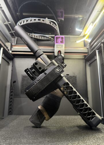 A black Taurus TX22 positioned at an angle, showcasing the Taurus TX22 integrated with our innovative 3D-printed Battle Chassis system.