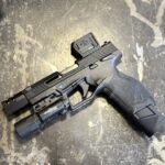 TX22 Black gun with light on bottom of barrel big optic and nice metal muzzle brake